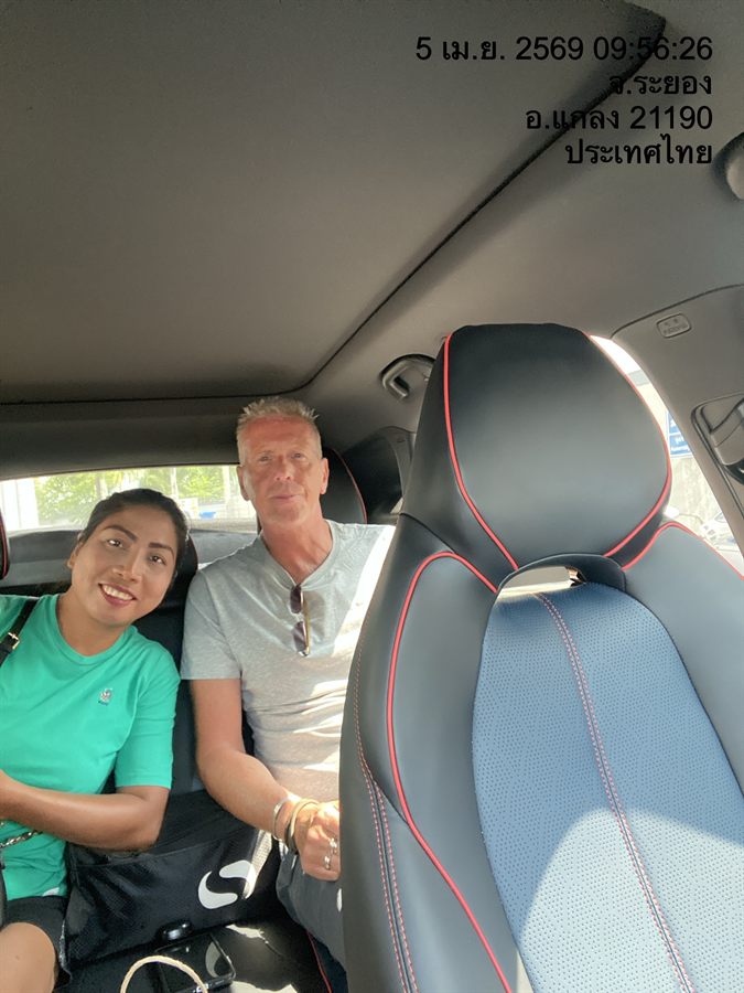 Two guests in the back seat of a WayGo sedan in Klaeng, Rayong.