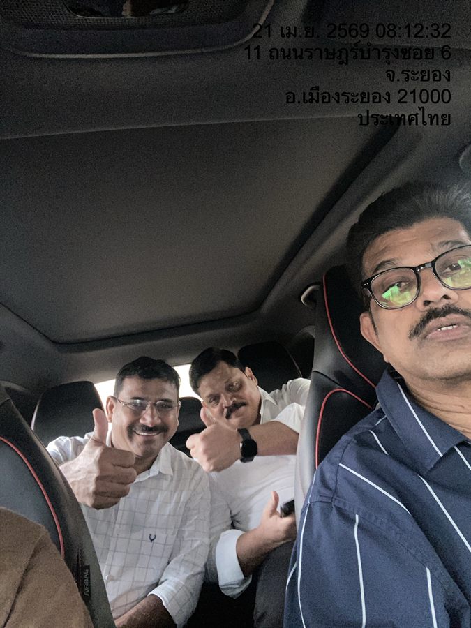 Three business guests riding together in a WayGo car in Rayong.