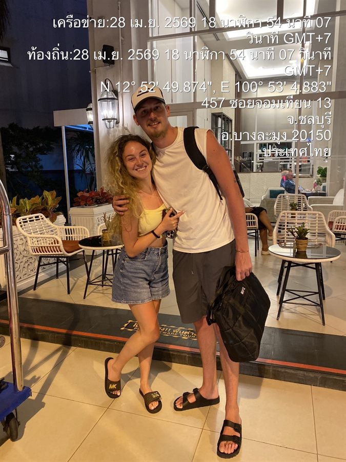 A couple with their bags at a Jomtien hotel after a WayGo evening transfer.